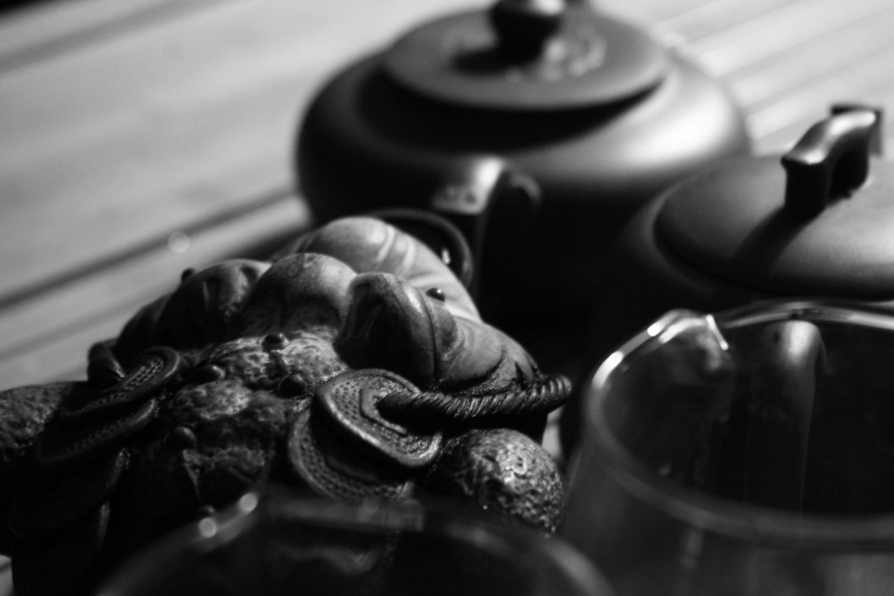 A friend on the tea table with a Yixing Pot of Pu-erh Tea.