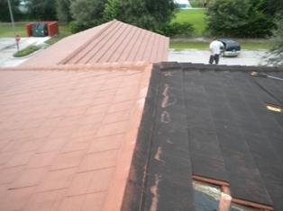 Extremely black tile roof cleaned w/ a 5 yr warranty