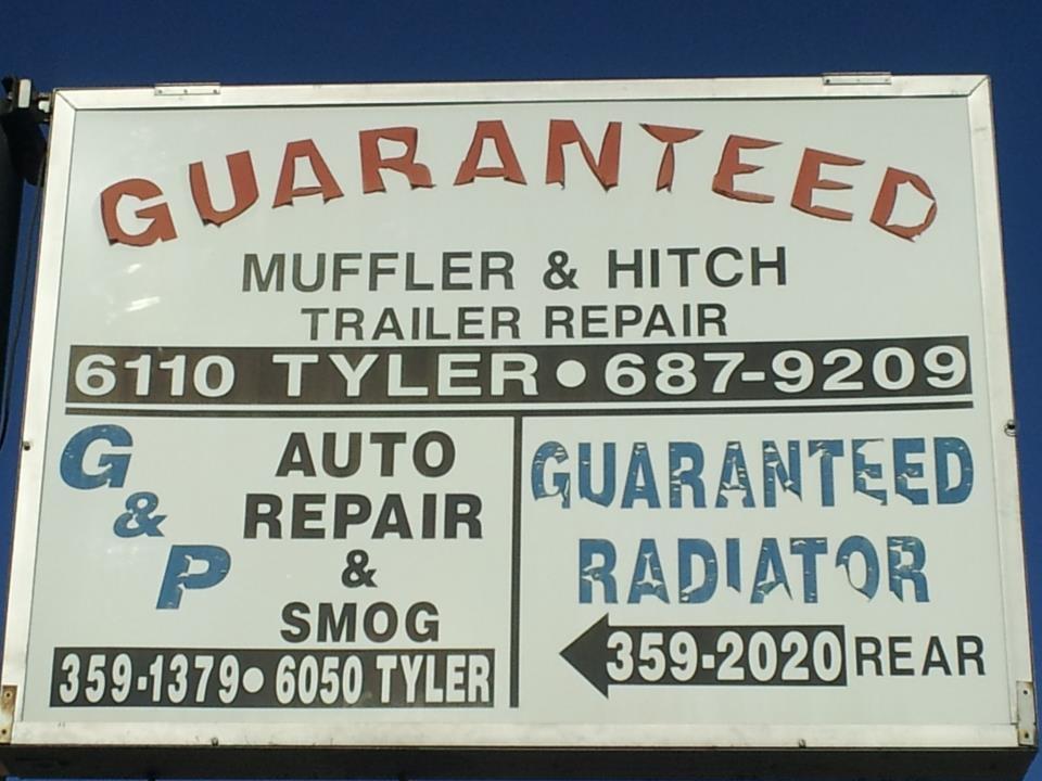 Front sign of Guaranteed Muffler off Tyler