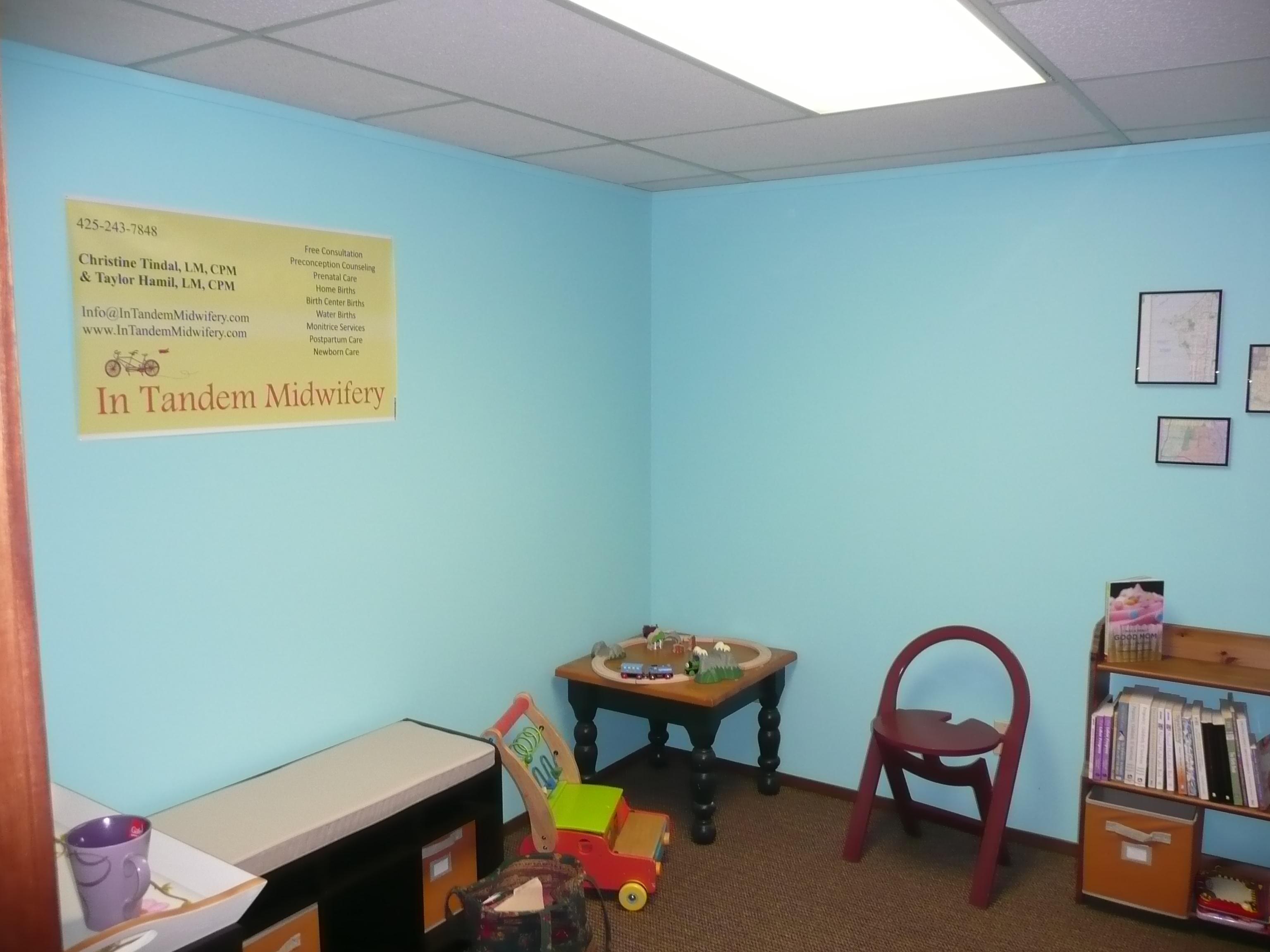 Our sitting room, complete with toys for older children, tea and a lending library for moms-to-be & their partners.