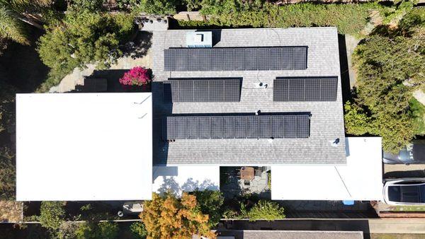 flat white portions are the new roof; remaining tar and gravel with solar panels is slanted