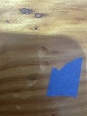 Another example of damage showing rounded indentations from desk hitting floor during move.