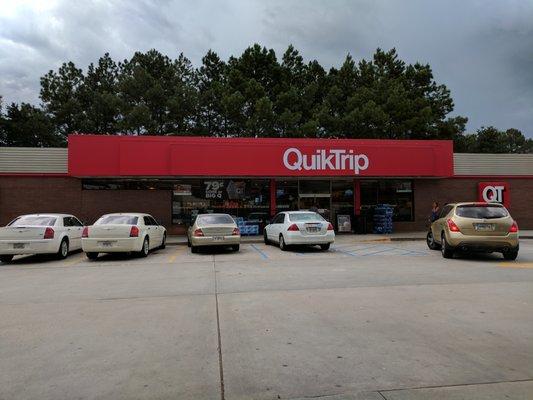 Outside. Storefront shot of convenience store.