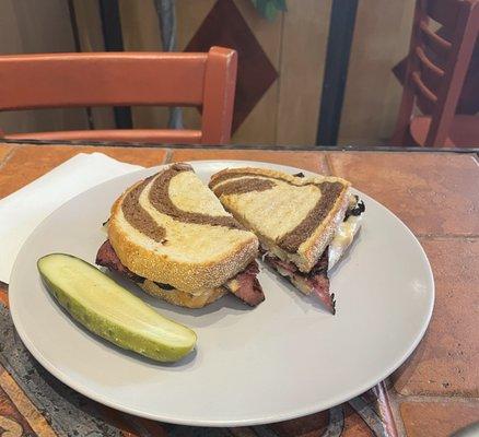 The Reuben Sandwich.  All great sandwiches come with a pickle!