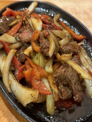 Country steak with peppers and onions