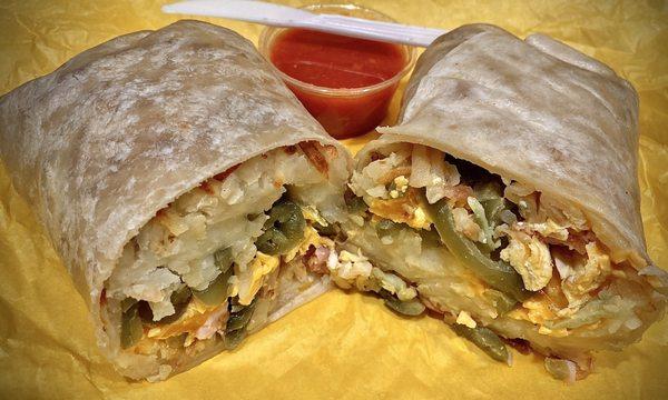 Hashbrowns, Jalapeños, ham, egg & cheese breakfast burrito by request, w/salsa. Nice