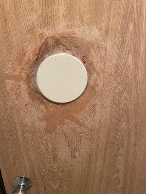 The "quick fix" for the door to the bathroom.