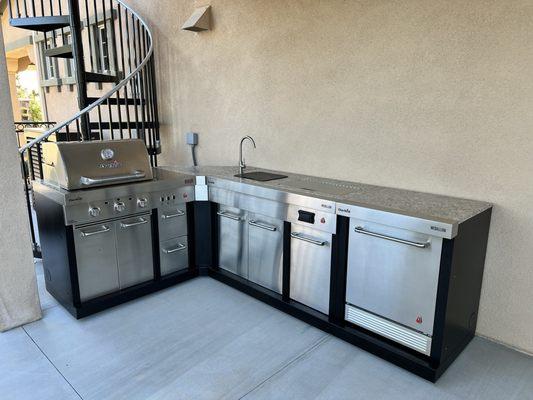 Modular outdoor kitchen was also installed.