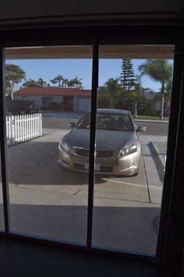 The Screen Machine's Finished Installation of the Lifestyle Single Car Garage with White Privacy Screen (view looking out)