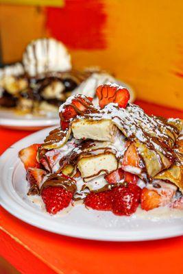 Cheesecake Crepe with New York Cheesecake, Fresh Strawberries, Any Chocolate and Whipped Cream.