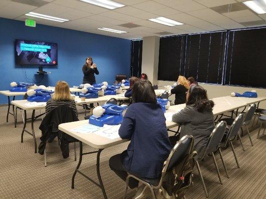 Our amazing instructor, Amanda, preparing the class for compressions.