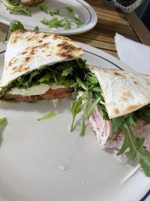 Mozzarella and basil panini and turkey and arugula panini