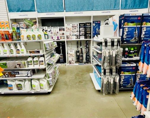 Cleaning section: vacuums, cleaning solutions, cloths