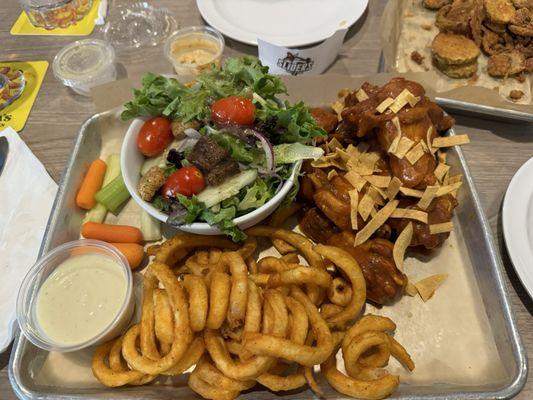 Taco wings, curly fries, salad with apple cider vinaigrette. Fried pickles in the background.