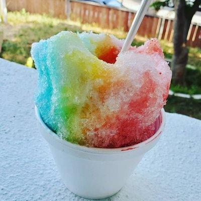 Shaved ice with blueberry, pineapple. & cherry flavors with vanilla ice cream at the bottom. Yummmm