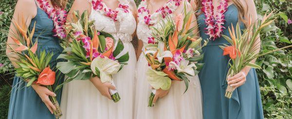 Tropical bouquets on far left and far right; tropical bouquets with added garden bunches in center.