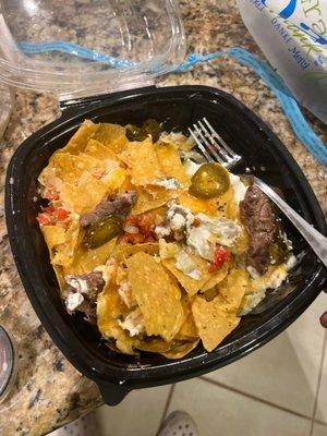 Whole lotta steak nachos? with only 3 pieces of meat and no queso