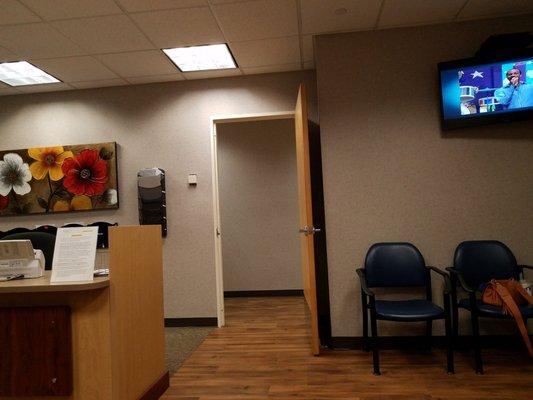 Waiting area, one TV with some kids programming on loop.