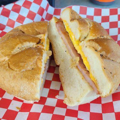 Ham steak and egg sandwich on a Kaiser roll