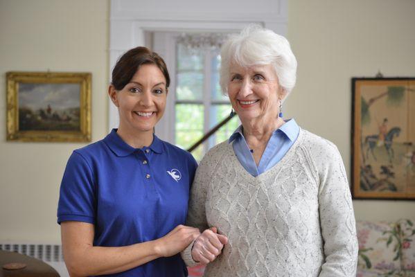 caregiver taking a photo with senior client