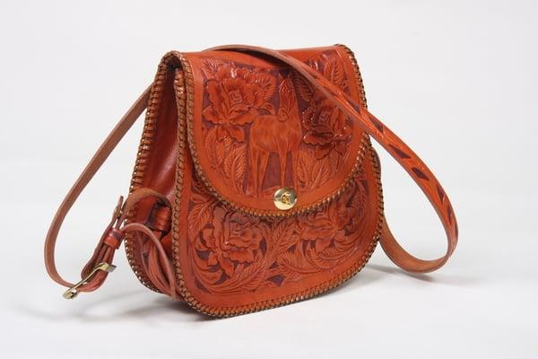 Hand carved/tooled handbag in natural tan finish.