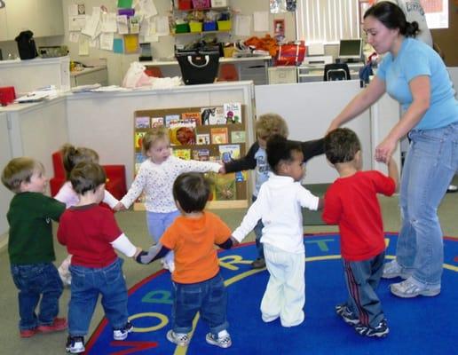 Dancing and singing with the toddler room teacher