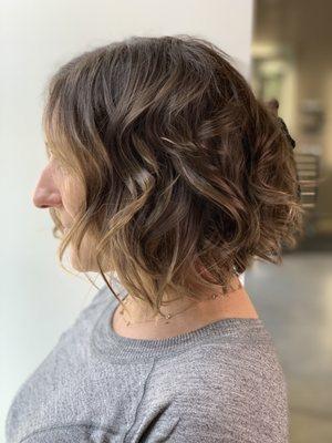 Cute textured nape bob styled with a fly iron for boho waves and put a ton of texture in the ends for when she wears it straight