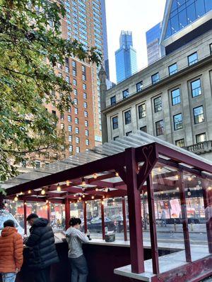 Standing room only gazebo, no seats.