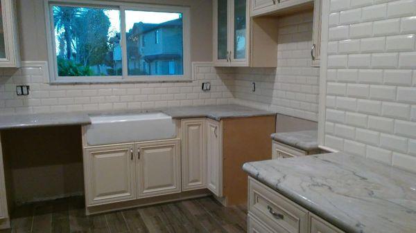 Tile Installation on kitchen floor and backsplash