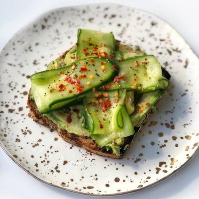 Here's our avocado cucumber tartine with tahini, lime juice, and red pepper flakes.