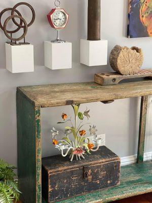 From Ramble: Wooden green console and flower chandelier