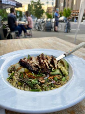 Healthy bowl topped with blackened chicken