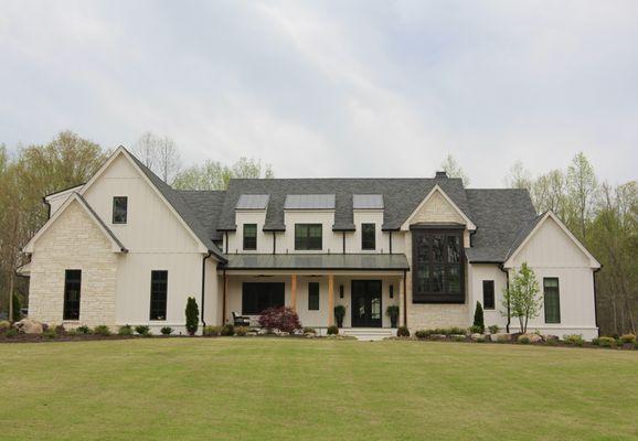 Modern farmhouse with over 47 Infinity from Marvin fiberglass windows.