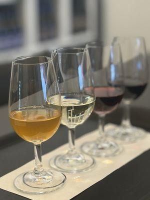 Wine tasting flight (front to back): Living Wine, Drum Roll White, Drum Roll Red, Syrah