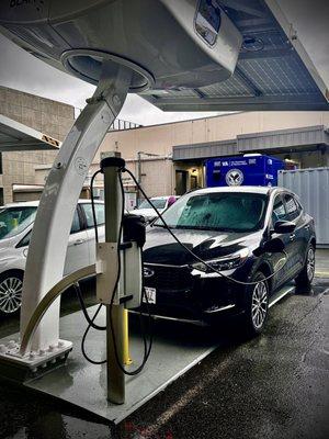 The parking lot has added solar powered electric vehicle charging stations for government vehicles.