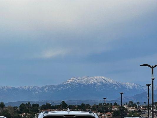 View from the north parking structure the dusting of the mountains.