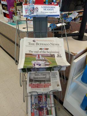 Grabbing a newspaper for my sad mom and dad. :-(