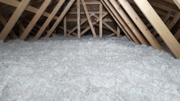 Blown in fiberglass insulation in the attic.