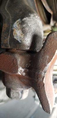 Bolt that holds the lower ball joint to the spindle