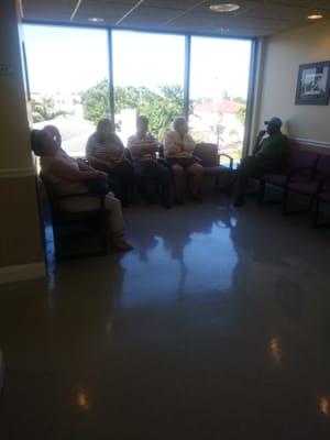 Dozens of elderly people waiting for hours for a 2 mins appointment with a doctor no more than 6 months out of school.