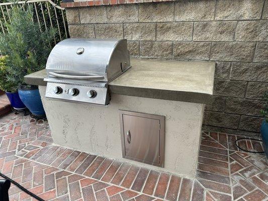 BBQ island renew, concrete countertop, stainless steel, and improved electrical, gas. New stucco surrounding, to match.