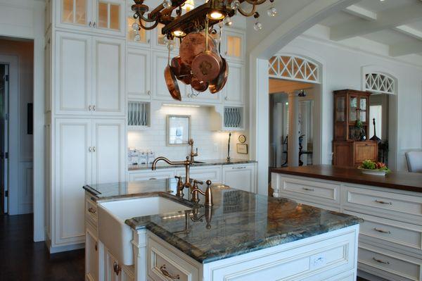 Large traditional kitchen with two large islands and farmhouse sink