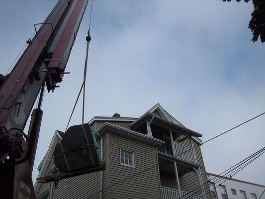 Piano going down by crane