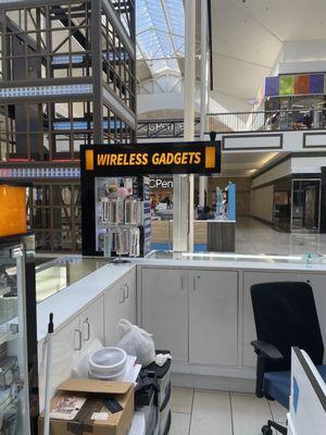 The sign of the kiosk shop in the mall