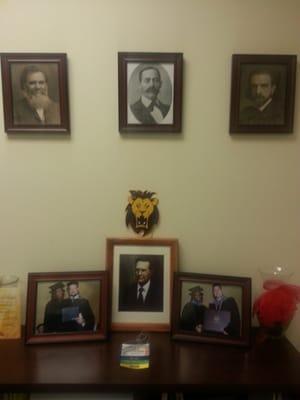 Dr. Herman's wall of Upper Cervical Chiropractic history with Dr. DD & BJ Palmer, Dr. William Blair and Harvey Lillard.