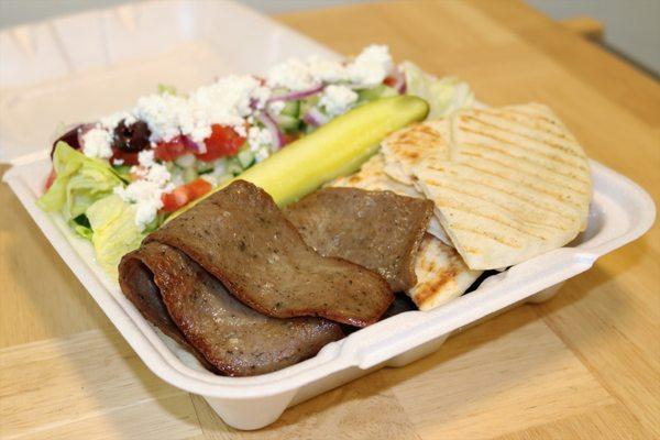 Gyro Platter comes with our side Mediterranean salad, Warm Pita bread, and a pickle wedge!