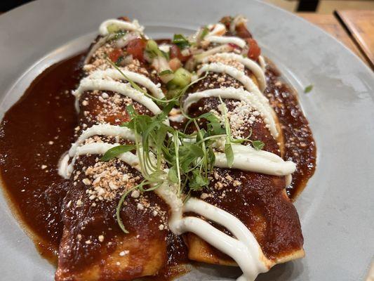 Carne asada enchiladas with salsa roja