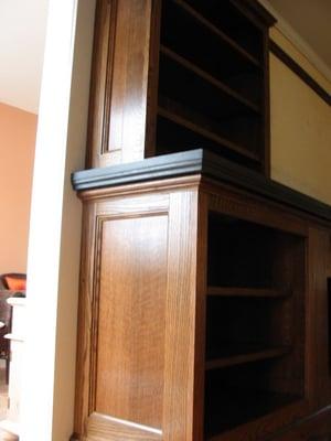 Detail of an oak and granite mantle bookcase in this award-winning historic home in Glen Ridge, NJ.