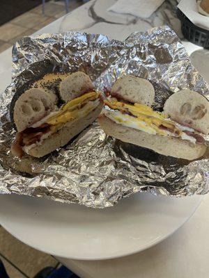 Bacon egg & cheese with grape jelly on a poppy seed bagel.