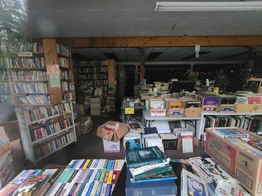 This is the check out counter, but customers can't get to it because of the clutter everywhere.